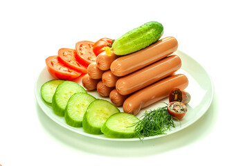 White background. Appetizing sausages, dill, with fresh cucumbers and tomatoes on a white plate.