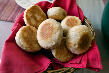 Bread roles in a basket on table