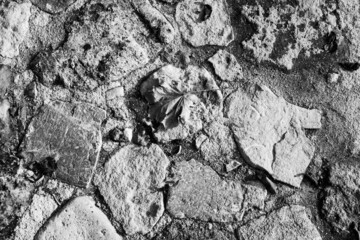 Grey stone wall texture. Antique natural stonewall. Old castle stone wall texture background. Stone wall as a background or texture for publication, design, poster.A place for your design or text