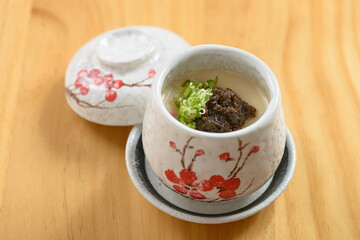 Japanese food Truffle Chawanmushi steamed egg served in a bowl isolated on wooden background top view