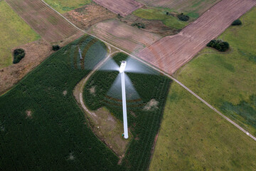 Going green with a wind power from a modern eco windmill turbine.