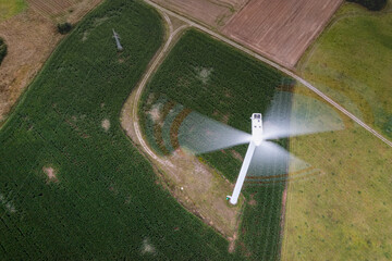 Going green with a wind power from a modern eco windmill turbine.