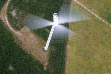 Going green with a wind power from a modern eco windmill turbine.