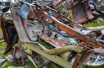 Piles of old rusty soviet crushed trucks in scrap metal yard. Car recycling