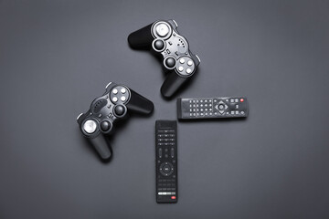 Remote controllers and joysticks on dark background © Pixel-Shot