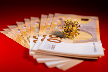 Gold virus on a fifty euro banknote. Concept with bank virus money