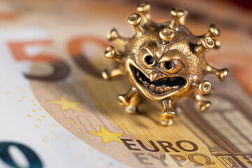 Gold virus on a fifty euro banknote. Concept with bank virus money