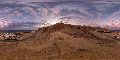 full seamless spherical hdri 360 panorama view of sunset on coast of sea high in sandy mountains...