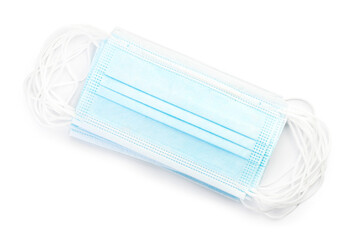 Stack of medical masks on white background