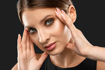 Fototapeta premium Portrait of attractive girl with healthy clean skin and beautiful make-up. Aesthetic cosmetology and makeup concept.