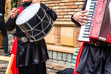 Street musicians in Georgia playing the drum and harmonica