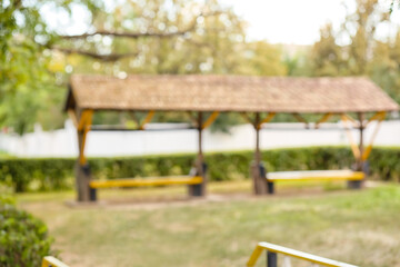 Naklejka premium Landscape with benches in park, blurred view