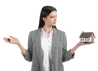 Real estate agent with figure of house and key on white background