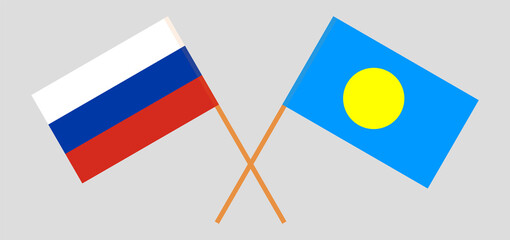 Crossed flags of Russia and Palau. Official colors. Correct proportion