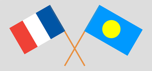 Crossed flags of France and Palau. Official colors. Correct proportion