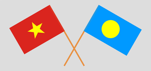 Crossed flags of Vietnam and Palau. Official colors. Correct proportion