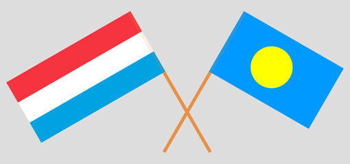 Crossed flags of Luxembourg and Palau. Official colors. Correct proportion