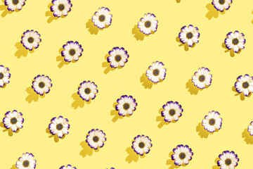Bright spring inspired floral pattern against pastel yellow background.