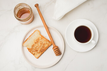 Croutons for breakfast with honey and coffee.