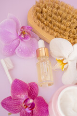 body care cosmetics set on pink background, top view, spa day, women's day