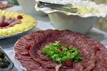 delicious sliced ​​cheese with salami ham and salad, party buffet