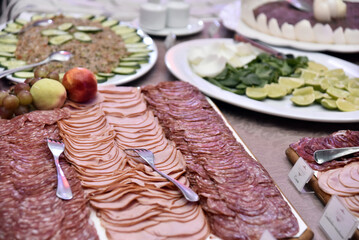 delicious sliced ​​cheese with salami ham and salad, party buffet