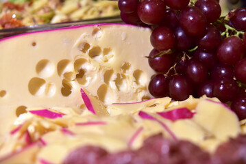 delicious sliced ​​cheese with salami ham and salad, party buffet