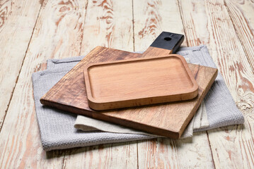 Wooden boards and napkin on table