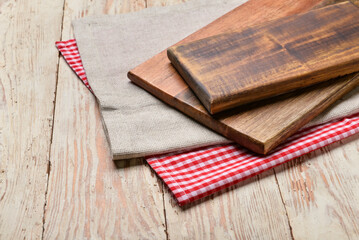 Fototapeta premium Cutting boards on wooden background