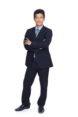 The face of success. An isolated portrait of a confident young businessman with his arms crossed.