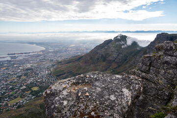 View from Table Mountain over Cape Town with a cloudy sky