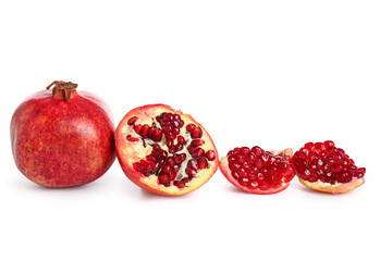 Tasty ripe pomegranates on white background