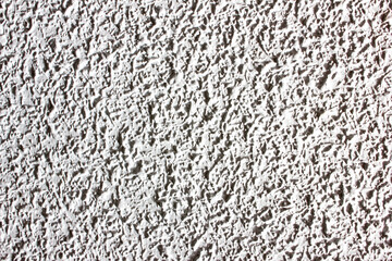 Textured wall with stippled wallpaper, background for texts. Copy space.