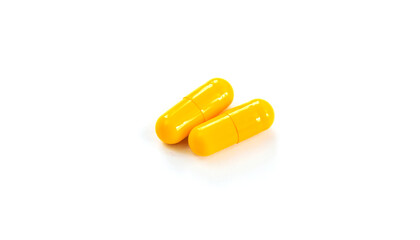 Pills and capsules isolate on white background. Selective focus.
