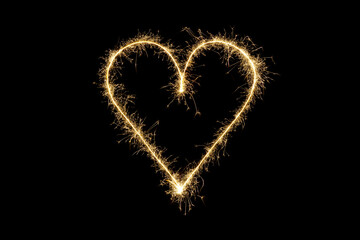 Heart shape made of sparks. Valentine's day love symbol, bright heart on black background