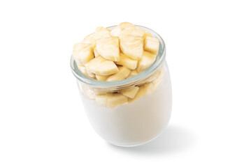 Greek yogurt with banana slices in a glass on a white isolated background