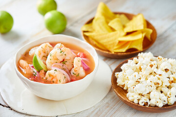 Ecuadorian shrimp ceviche, a traditional appetizer. On a white wooden table.  - obrazy, fototapety, plakaty