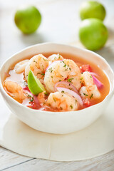 Ecuadorian shrimp ceviche, a traditional appetizer. On a white wooden table. 