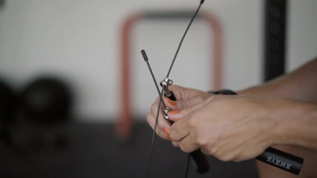hands of a young spanish woman holding a camber