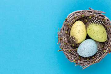 Easter eggs in the nest. Spring greeting card.