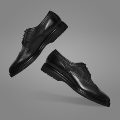 Leather men's shoes on a grey background