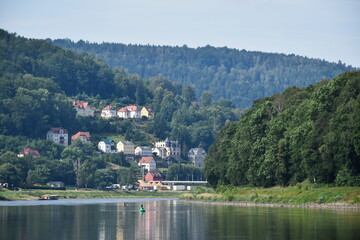 Fototapeta premium a boat trip on the river surrounded by a beautiful landscape