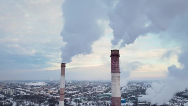 Industrial factory smokestack emission carbon gases and in atmosphere. Industry zone, factory smoke plumes. Climate change, ecology and global warming