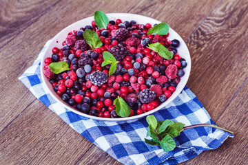 Forest Fruits on a Wooden Background
