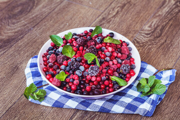 Forest Fruits on a Wooden Background