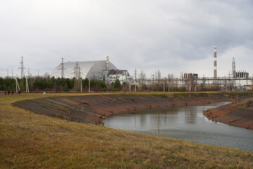 Abandoned Chernobyl Nuclear Power Station, block 4 covered with new sarcophagus, left after...