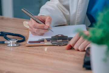 Fototapeta premium doctor hand writing in surgery or hospital