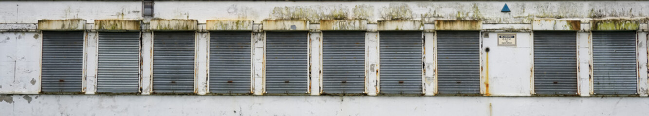 Office window shutters closed due to business closure