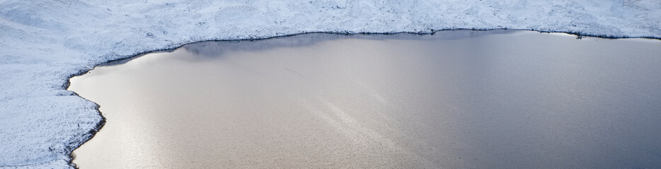 Rannoch Moor and Black Mount covered in snow during winter aerial view
