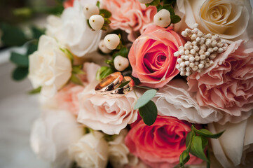Beautiful bridal bouquet, pair of gold wedding rings